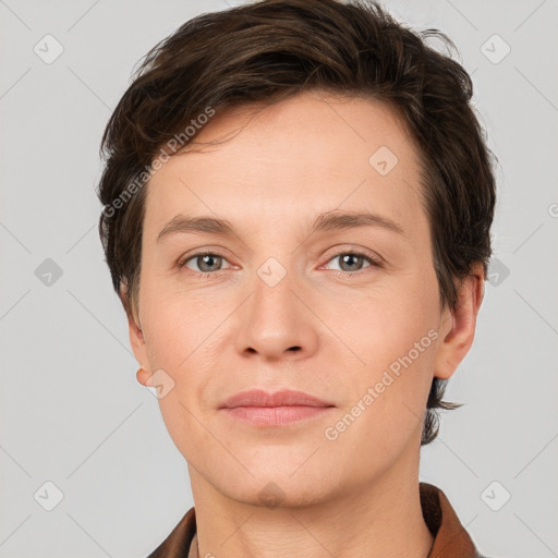 Joyful white young-adult female with short  brown hair and grey eyes