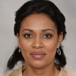 Joyful black young-adult female with medium  black hair and brown eyes
