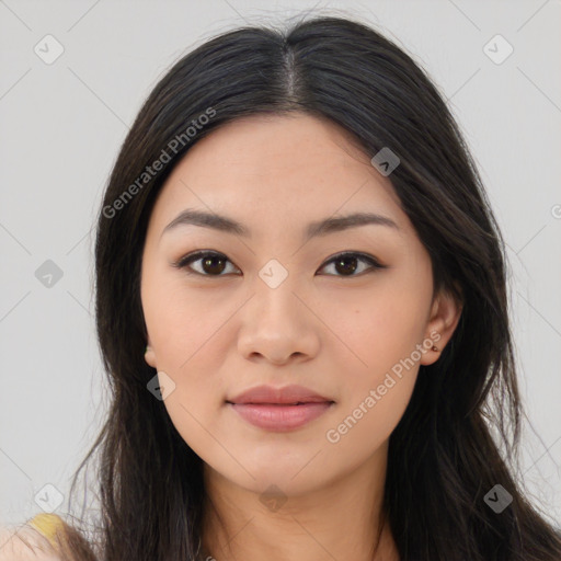 Joyful asian young-adult female with long  brown hair and brown eyes