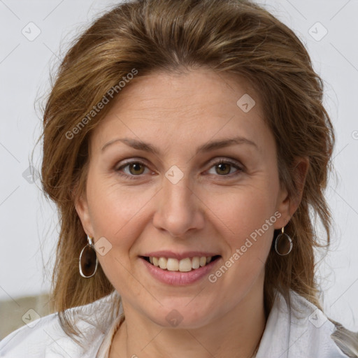 Joyful white adult female with medium  brown hair and grey eyes