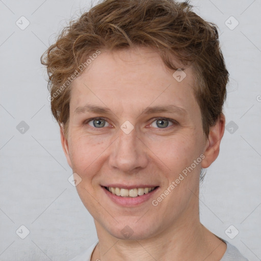 Joyful white adult female with short  brown hair and grey eyes