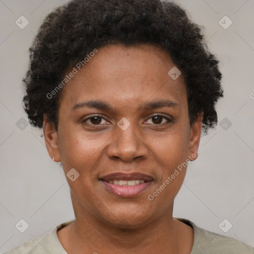 Joyful black adult female with short  brown hair and brown eyes