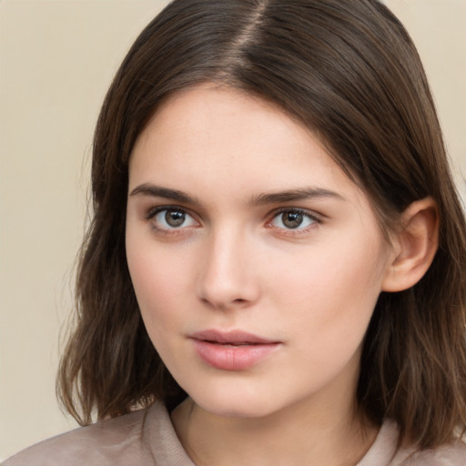 Neutral white young-adult female with medium  brown hair and brown eyes