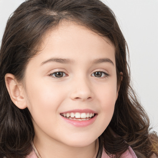 Joyful white child female with long  brown hair and brown eyes