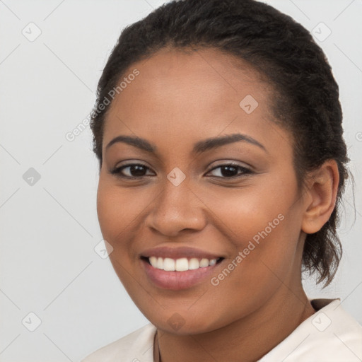 Joyful latino young-adult female with long  brown hair and brown eyes