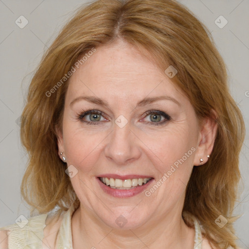 Joyful white adult female with medium  brown hair and blue eyes