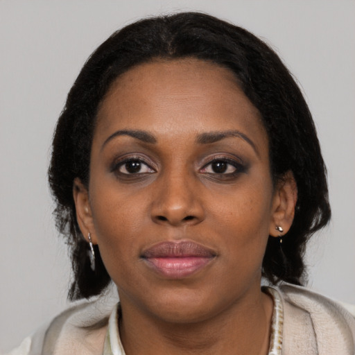 Neutral black young-adult female with short  black hair and brown eyes