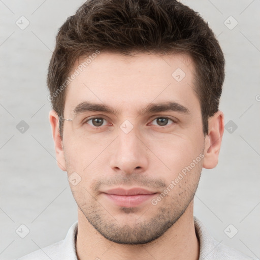 Neutral white young-adult male with short  brown hair and brown eyes