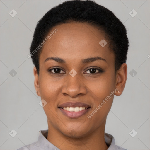 Joyful black young-adult female with short  black hair and brown eyes