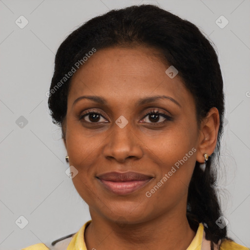 Joyful black adult female with short  brown hair and brown eyes