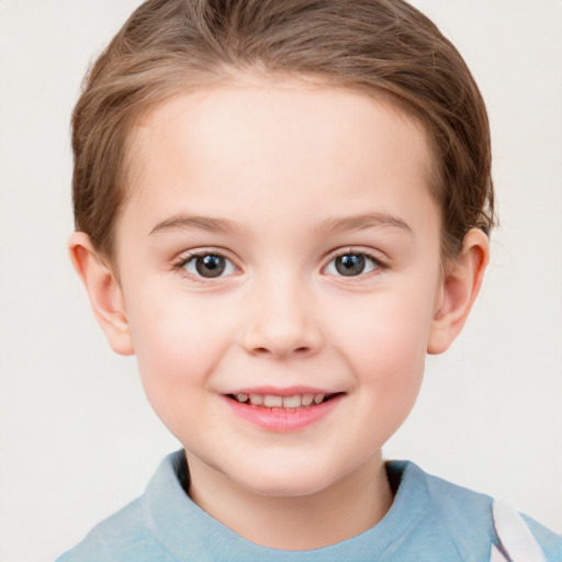 Joyful white child female with short  brown hair and grey eyes