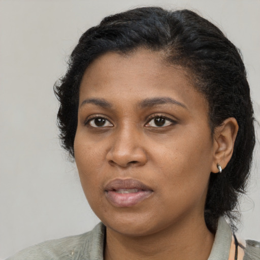 Neutral black young-adult female with medium  black hair and brown eyes