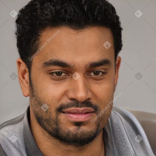 Joyful black young-adult male with short  black hair and brown eyes