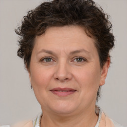 Joyful white adult female with short  brown hair and brown eyes