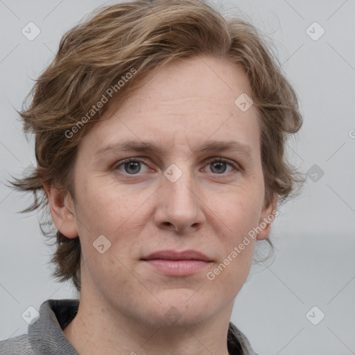 Joyful white adult female with medium  brown hair and blue eyes