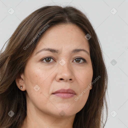 Joyful white adult female with long  brown hair and brown eyes