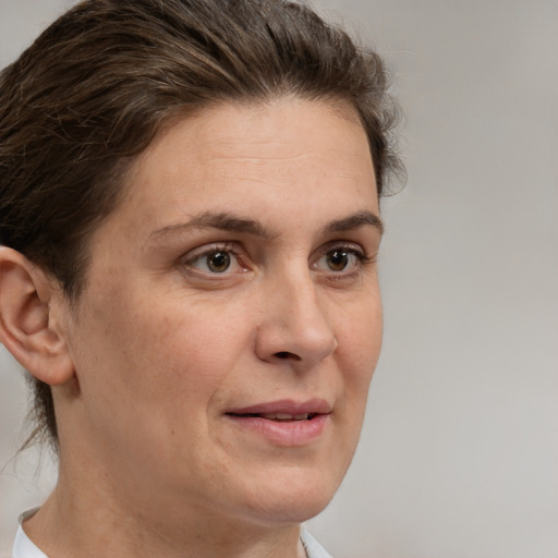 Joyful white adult female with short  brown hair and brown eyes