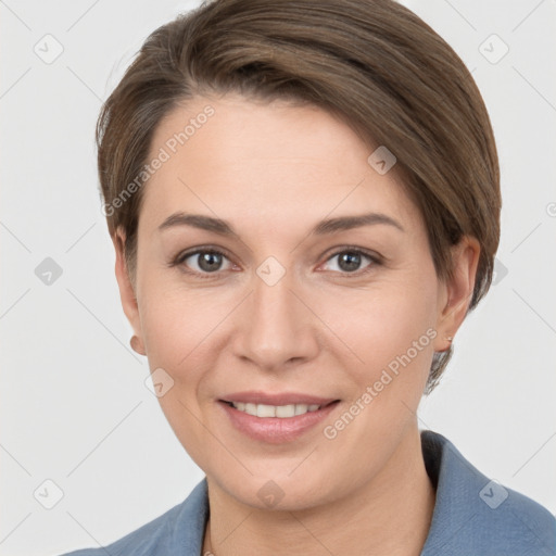 Joyful white young-adult female with short  brown hair and grey eyes