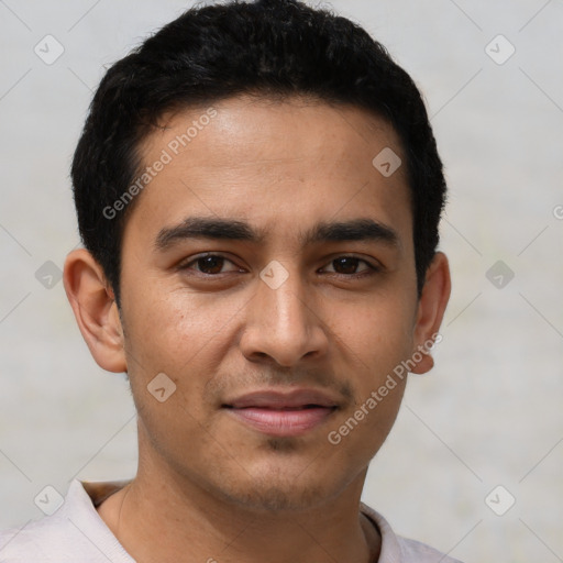 Joyful latino young-adult male with short  black hair and brown eyes