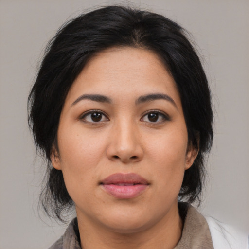 Joyful asian young-adult female with medium  brown hair and brown eyes