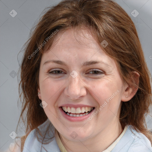 Joyful white young-adult female with medium  brown hair and blue eyes