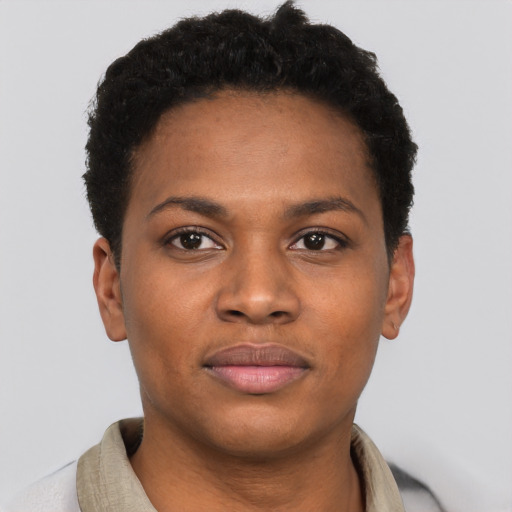 Joyful black young-adult female with short  black hair and brown eyes