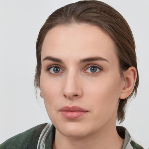 Neutral white young-adult female with medium  brown hair and grey eyes