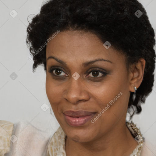 Joyful black adult female with short  brown hair and brown eyes