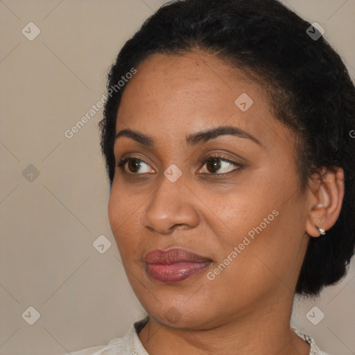 Joyful latino young-adult female with short  black hair and brown eyes