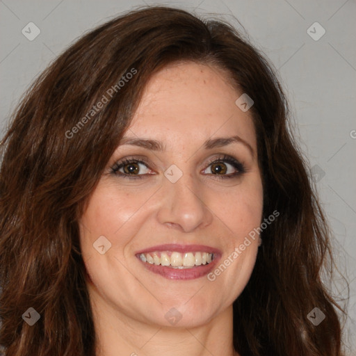 Joyful white adult female with long  brown hair and brown eyes