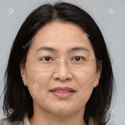 Joyful white adult female with medium  brown hair and brown eyes