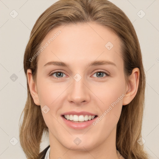 Joyful white young-adult female with long  brown hair and grey eyes