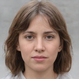 Neutral white young-adult female with medium  brown hair and grey eyes