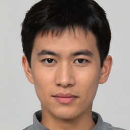 Neutral asian young-adult male with short  brown hair and brown eyes