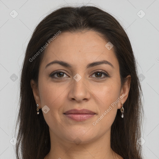 Joyful white adult female with long  brown hair and brown eyes