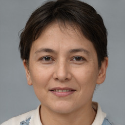 Joyful white adult female with short  brown hair and brown eyes