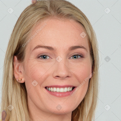 Joyful white adult female with long  brown hair and blue eyes