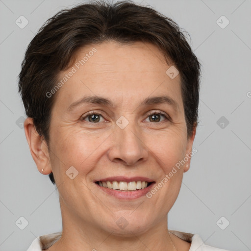 Joyful white adult female with short  brown hair and brown eyes