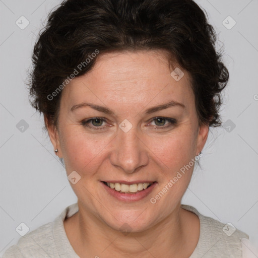 Joyful white adult female with short  brown hair and brown eyes