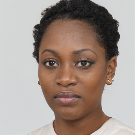 Neutral black young-adult female with short  black hair and brown eyes