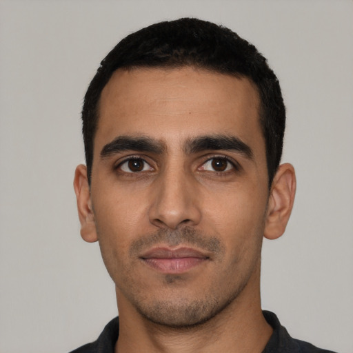 Neutral latino young-adult male with short  black hair and brown eyes