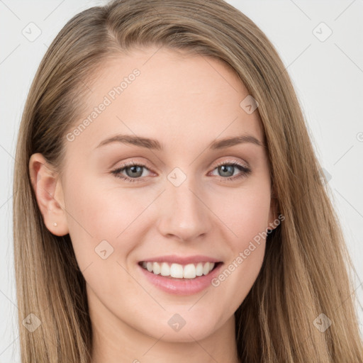 Joyful white young-adult female with long  brown hair and blue eyes