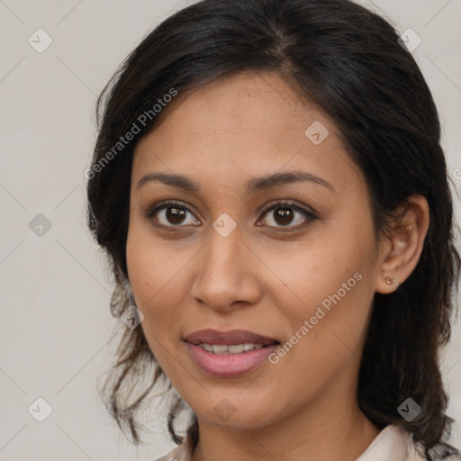 Joyful latino young-adult female with medium  brown hair and brown eyes