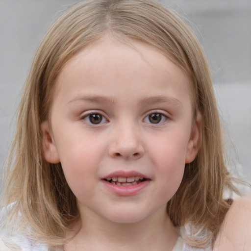 Joyful white child female with medium  brown hair and blue eyes