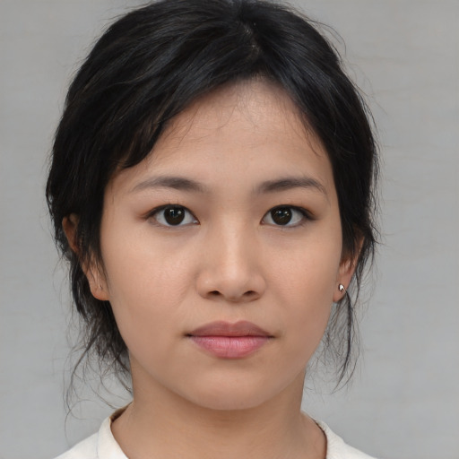 Neutral asian young-adult female with medium  brown hair and brown eyes