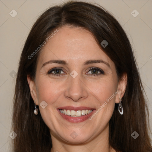 Joyful white adult female with long  brown hair and brown eyes