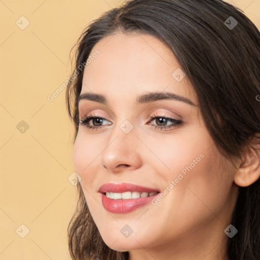 Joyful white young-adult female with long  brown hair and brown eyes