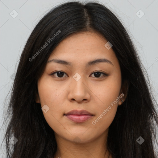 Joyful asian young-adult female with long  brown hair and brown eyes