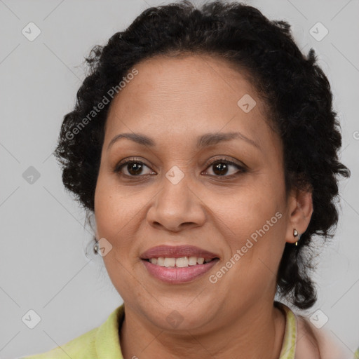 Joyful latino adult female with short  brown hair and brown eyes