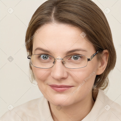 Joyful white young-adult female with medium  brown hair and green eyes